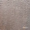 Kahverengi ve toprak tonlarında, sedefli parlamalar içeren, pürüzlü beton dokulu dekoratif duvar tasarımı